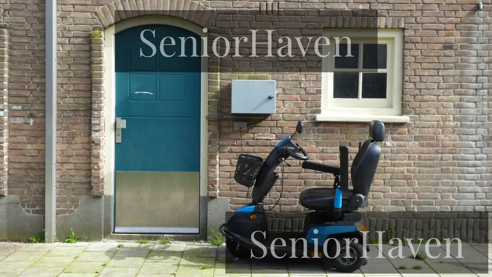 A compact mobility scooter parked outdoors beside a brick wall