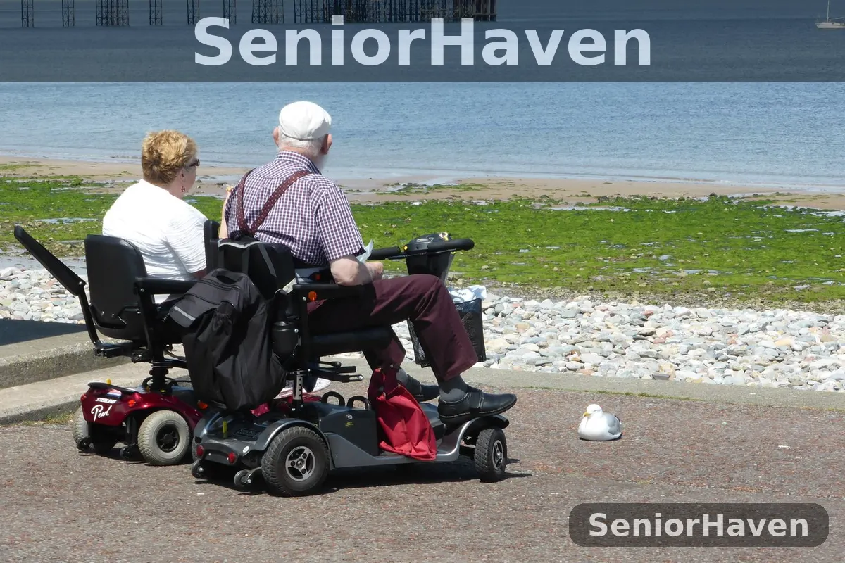 An older couple on two mobility scooters looking out to sea from a seafront promenade