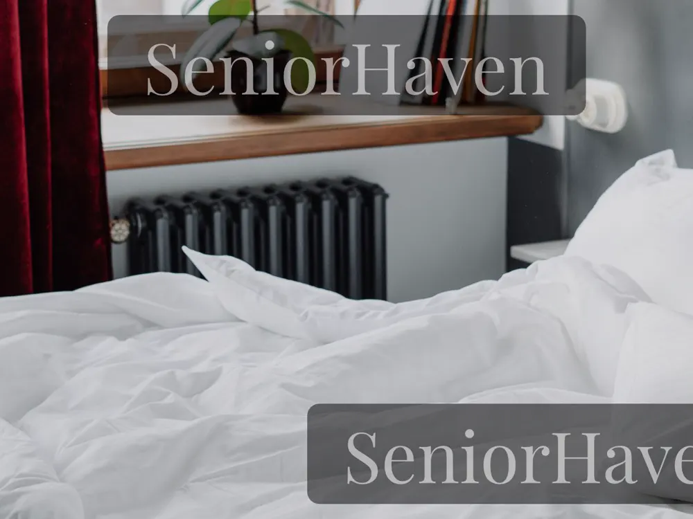 Finned radiator heater under a window beside a bed in a quiet bedroom
